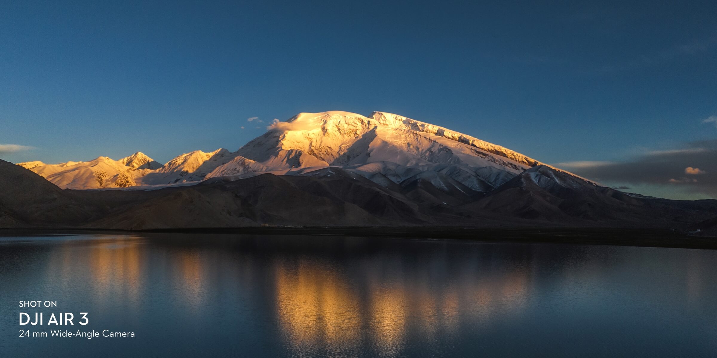 Mountain and lake shot on DJI Air 3 24mm medium tele camera